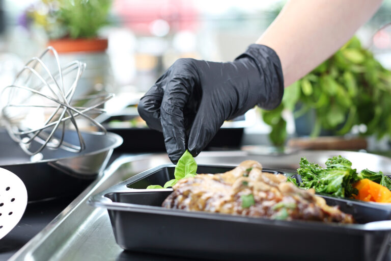 Catering. Meal prep.The cook prepares take-out dishes.